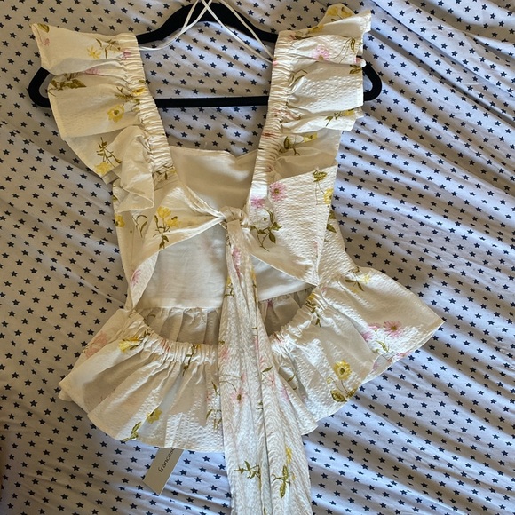 Super cute summer floral backless top. Never worn. Tabs still on - Picture 2 of 6